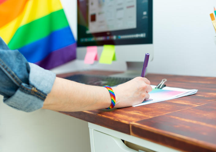 LGBTQ Inclusion in the workplace represented by individual wearing a pride bracelet