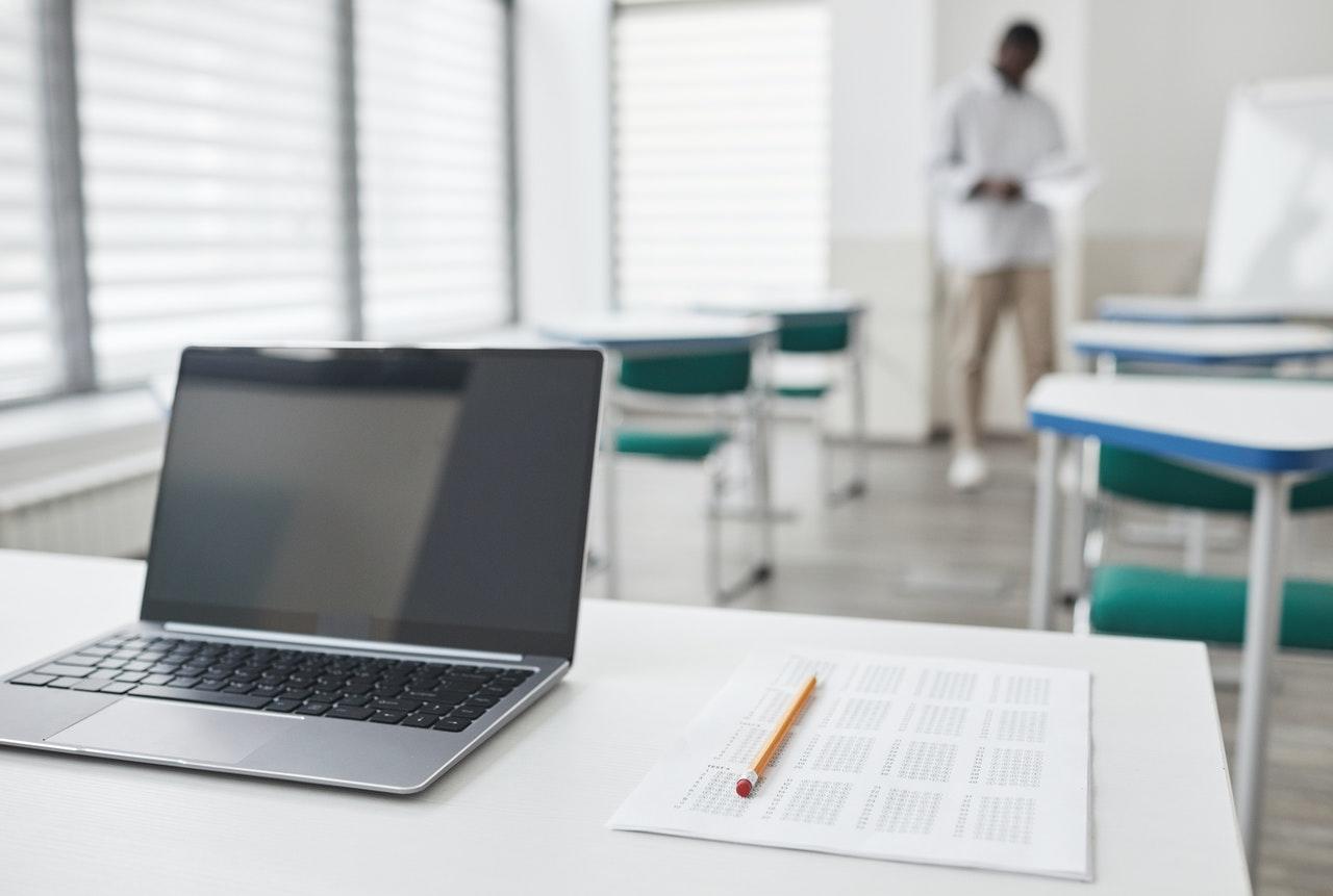 Laptop next to Scantron sheet