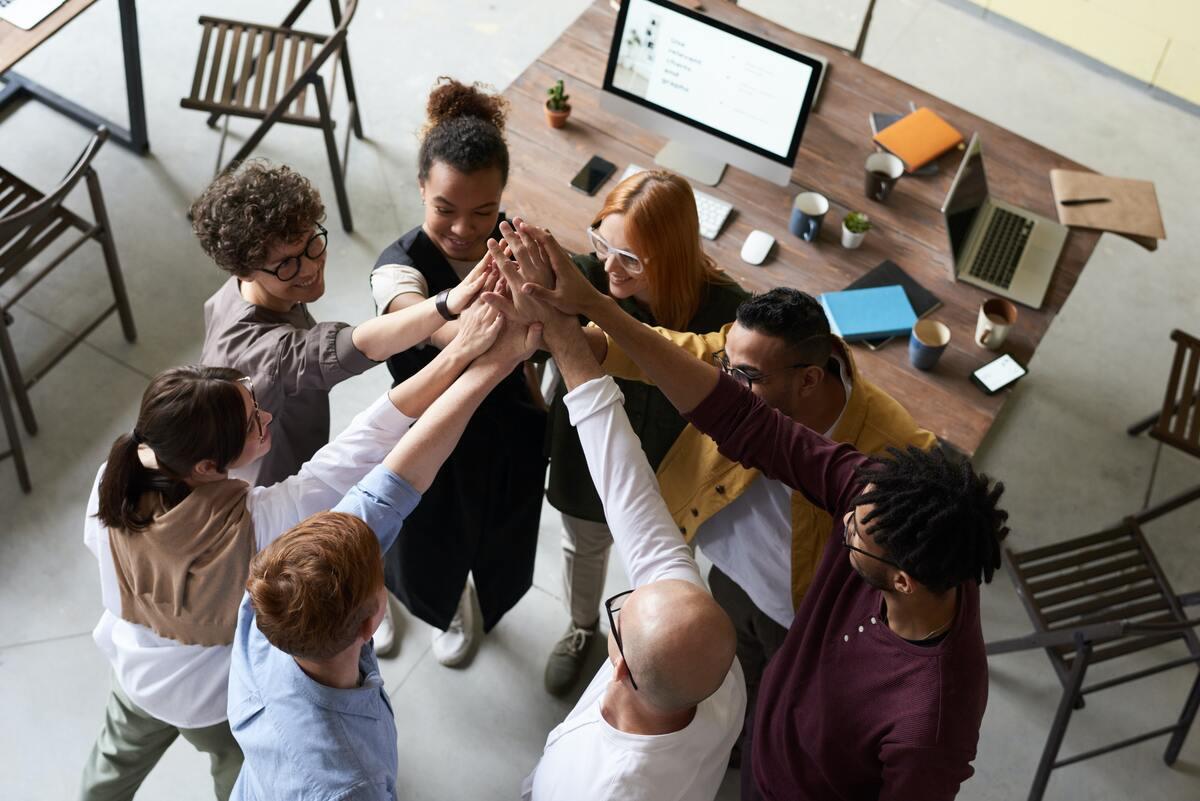 Diverse group of teammates high-fiving