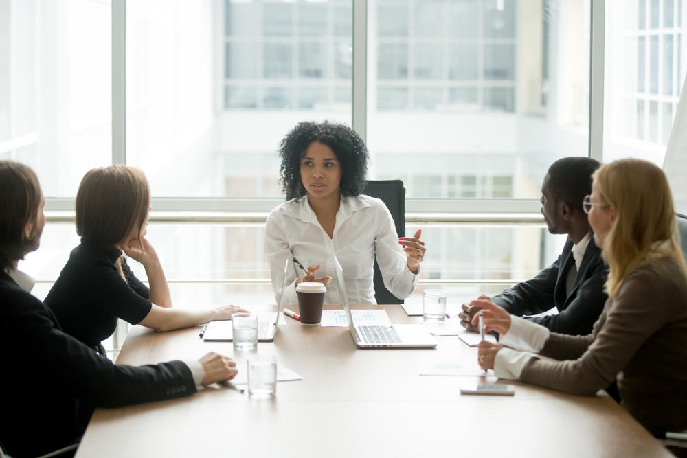 woman speaking in a boardroom