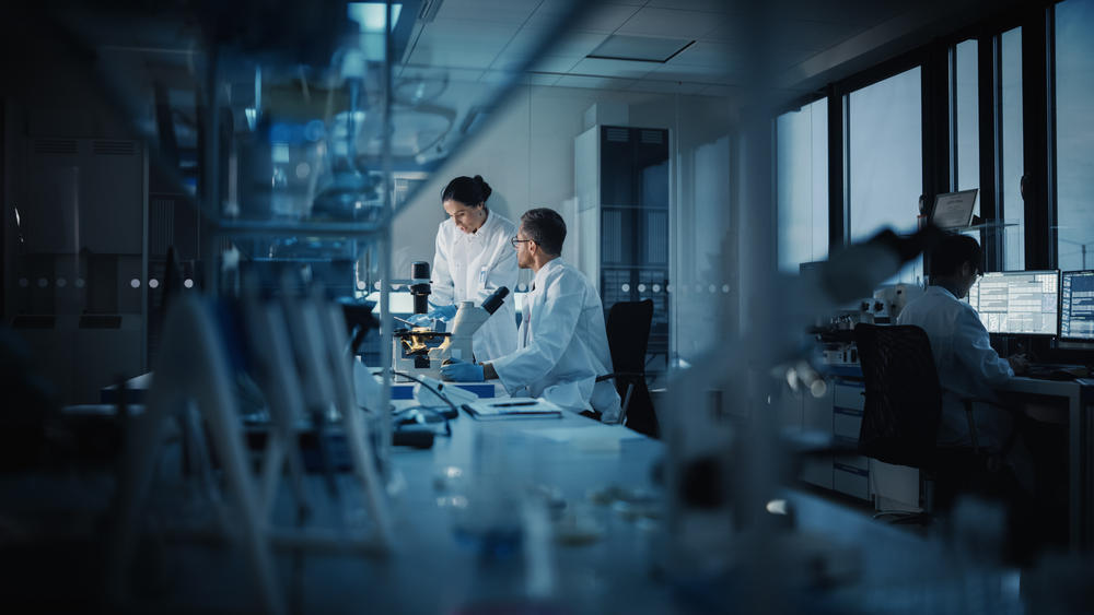 three scientists working in a lab