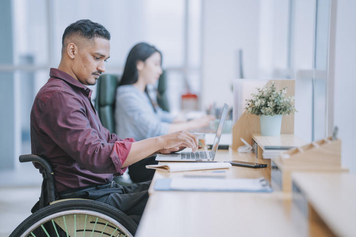 person typing on a laptop at a desk