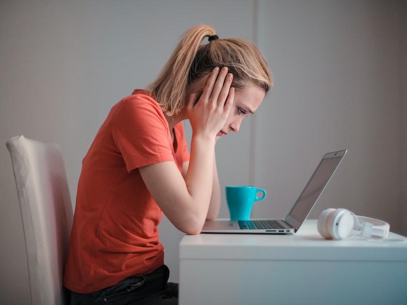 woman looking at taxes due on student loan forgiveness