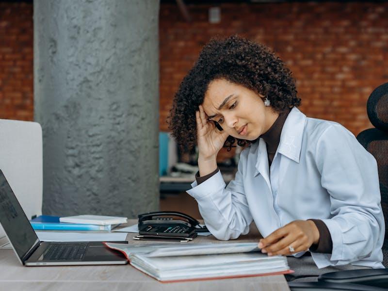 Female accountant reading through changes in Tax cuts and jobs act information