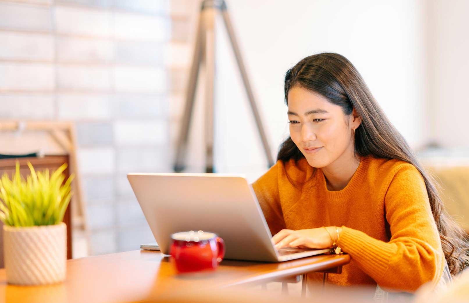 woman studying on a laptop