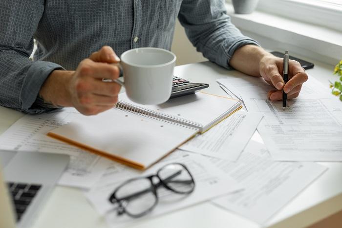 Accountant working on tax return using the 2024 tax changes as a guide. 